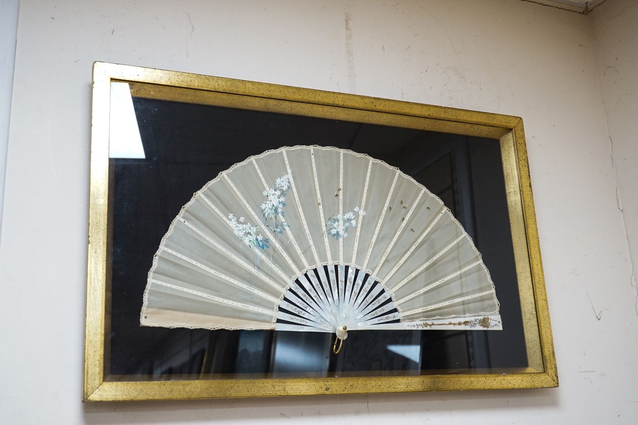 A framed 19th century French mother of pearl and painted silk fan, approx. 60cm long excl frame